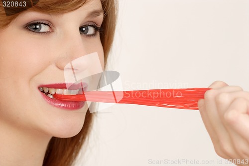 Image of Woman eating gum