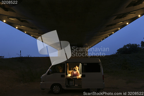 Image of Camping under a bridge