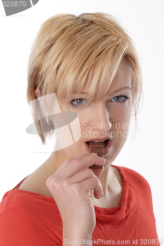 Image of Woman eating chocolate