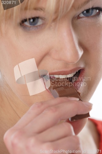 Image of Woman eating chocolate