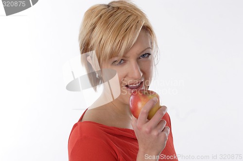 Image of Woman eating apple