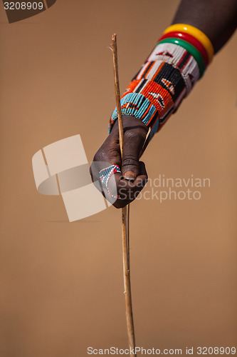 Image of hand Holding a stick