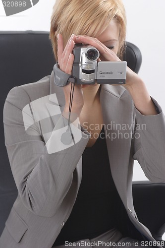 Image of Businesswoman with video camera