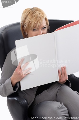 Image of Businesswoman reading book