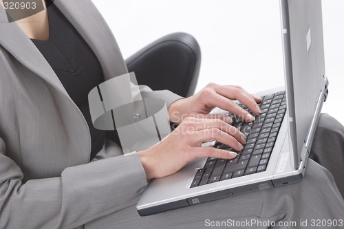 Image of Businesswoman using laptop