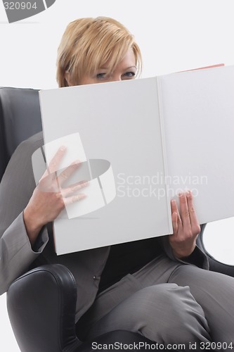 Image of Businesswoman reading book