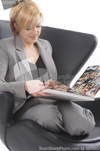 Image of Businesswoman reading book