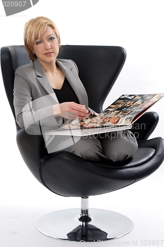 Image of Businesswoman reading book
