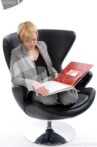 Image of Businesswoman reading book