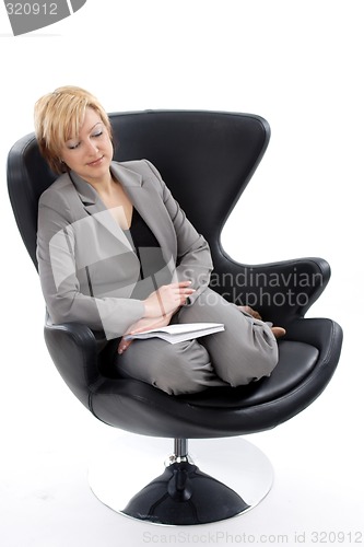 Image of Businesswoman sitting on chair