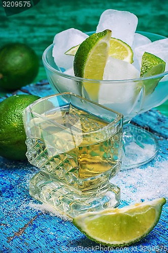 Image of alcoholic cocktail with additions of lime