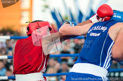 Image of A boxing match Osleys Iglesias, Cuba and Salah Mutselkhanov, Russia. Victory Osleys Iglesias