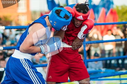 Image of A boxing match Osleys Iglesias, Cuba and Salah Mutselkhanov, Russia. Victory Osleys Iglesias