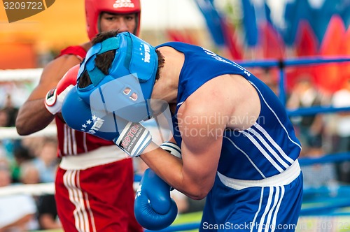 Image of A boxing match Osleys Iglesias, Cuba and Salah Mutselkhanov, Russia. Victory Osleys Iglesias