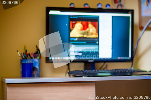 Image of blurred background of childs room with computer at home