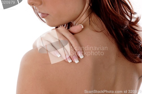 Image of Woman rubbing shoulder