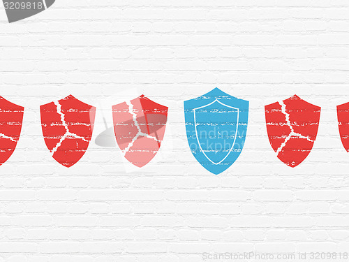 Image of Privacy concept: shield icon on wall background