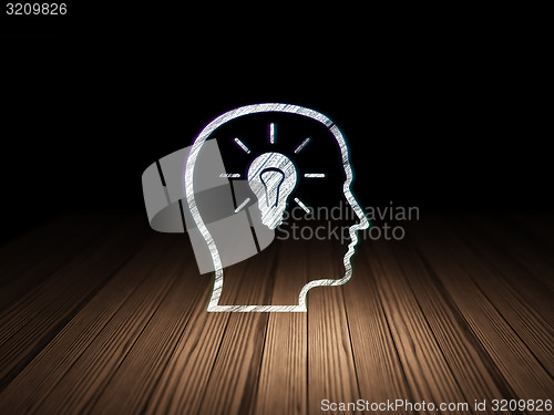 Image of Data concept: Head With Lightbulb in grunge dark room