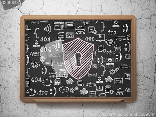 Image of Protection concept: Shield With Keyhole on School Board background