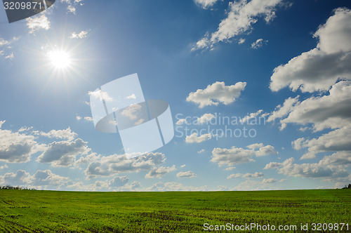 Image of green field and clouds