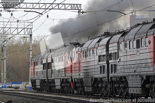 Image of The smoking engine moves in the ways.