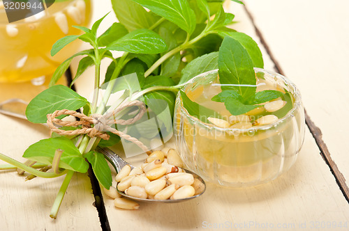 Image of Arab traditional mint and pine nuts tea