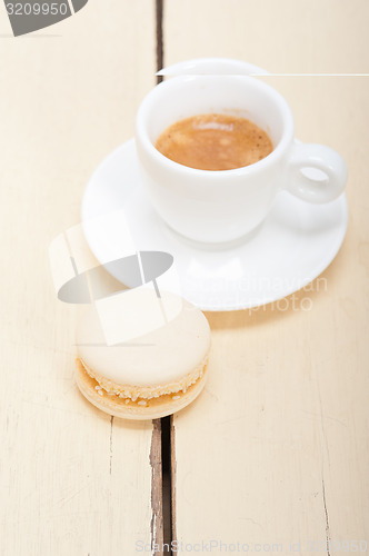 Image of colorful macaroons with espresso coffee 