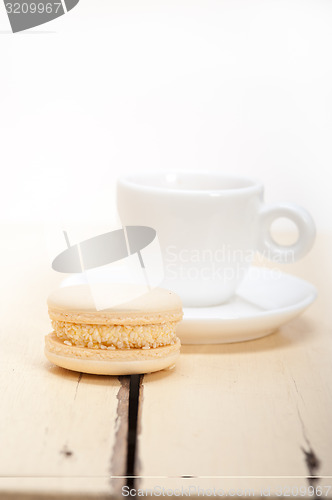 Image of colorful macaroons with espresso coffee 