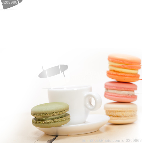 Image of colorful macaroons with espresso coffee 