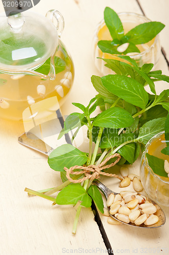 Image of Arab traditional mint and pine nuts tea