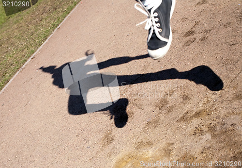 Image of human shadow in flying jump