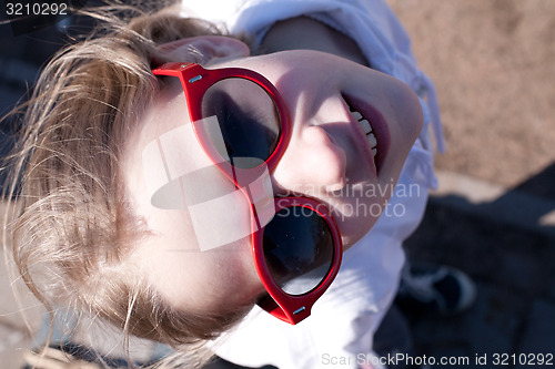 Image of young girl in sunglasses
