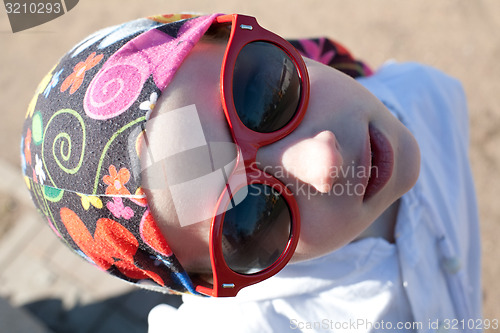 Image of young funny girl in sunglasses