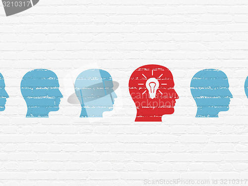 Image of Finance concept: head with light bulb icon on wall background
