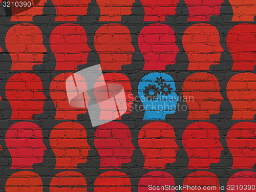 Image of Finance concept: head with gears icon on wall background