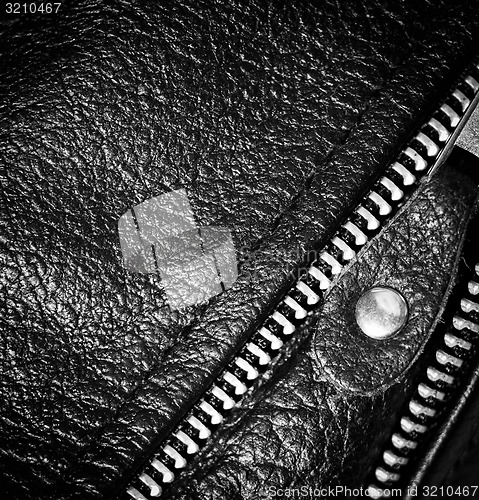 Image of black leather clothing with a zipper. macro photo