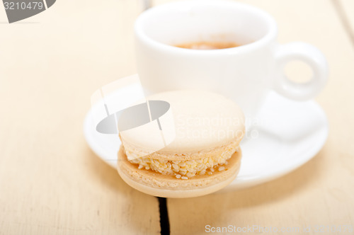 Image of colorful macaroons with espresso coffee 