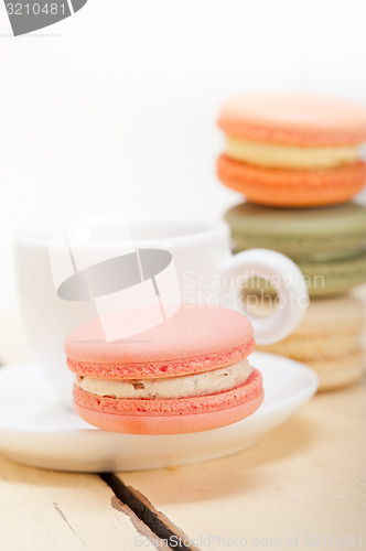 Image of colorful macaroons with espresso coffee 