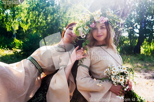 Image of Beautiful women relaxes on nature