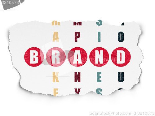 Image of Marketing concept: word Brand in solving Crossword Puzzle