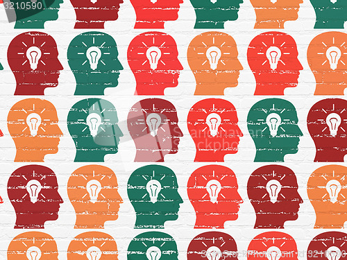 Image of Marketing concept: Head With Light Bulb icons on wall background