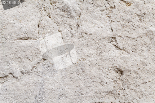 Image of Uneven Surface Texture Of An Ancient Square Stone