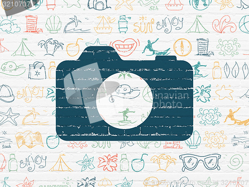 Image of Vacation concept: Photo Camera on wall background