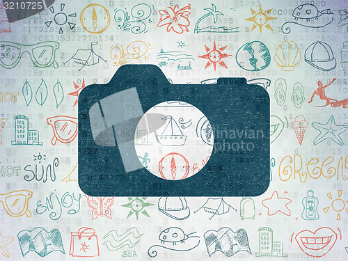 Image of Travel concept: Photo Camera on Digital Paper background