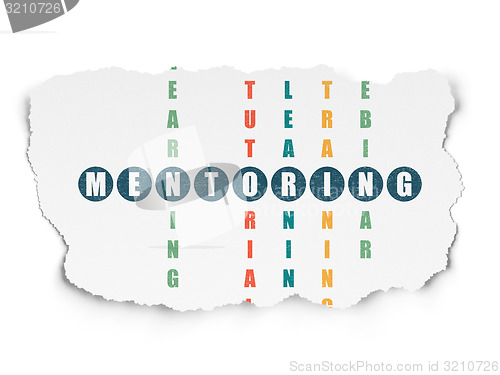 Image of Education concept: word Mentoring in solving Crossword Puzzle