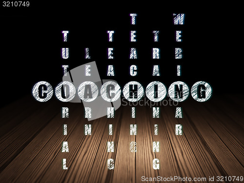 Image of Education concept: word Coaching in solving Crossword Puzzle