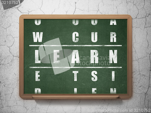Image of Education concept: word Learn in solving Crossword Puzzle