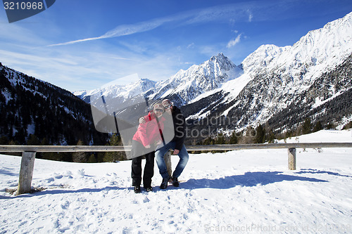 Image of Happy couple in winter landscape 