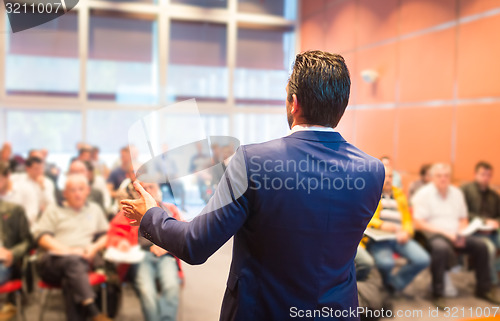 Image of Speaker at Business Conference and Presentation.