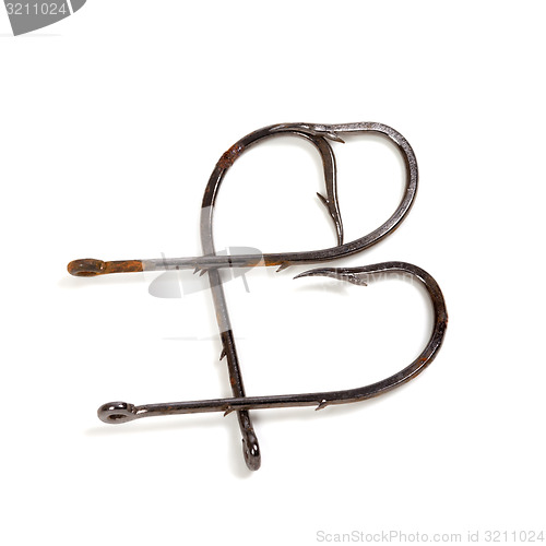 Image of Letter B composed of old rusty fish hooks